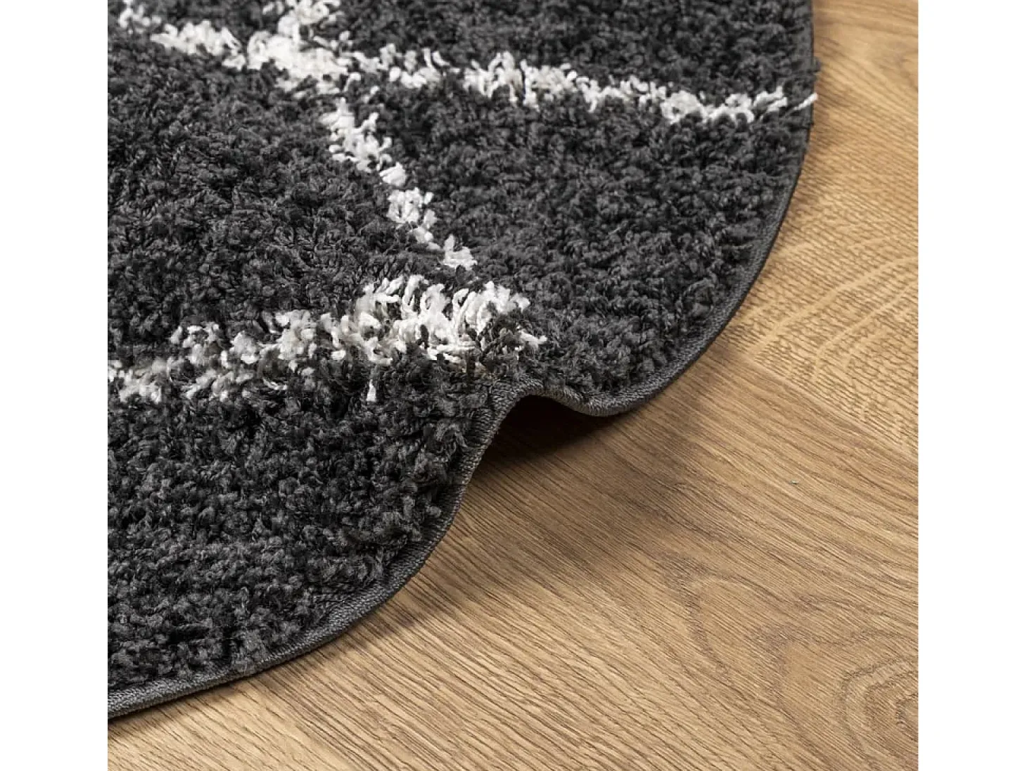 Alfombra moderna de pelo largo en color negro y crema, Ø 80 cm