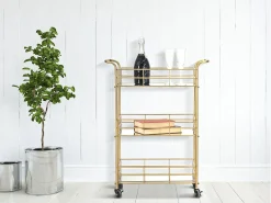 Carrito de bar rectangular dorado con estantes de vidrio espejado Glammy