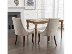 Conjunto de 2 sillas beige con patas de madera curvadas y respaldo alto.