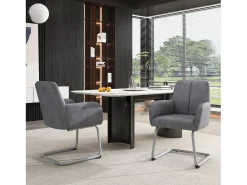 Conjunto de 2 sillas cantilever con reposabrazos, tapizado en símil piel gris, patas de metal color plata.