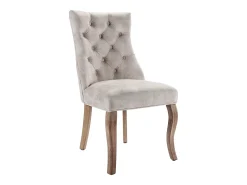 Conjunto de 4 sillas de terciopelo beige claro con patas de madera curvadas y botones decorativos.