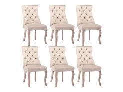 Conjunto de 6 sillas de terciopelo beige con patas de madera curvadas y botones decorativos.