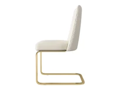 Juego de 2 sillas de comedor en terciopelo beige con respaldo tapizado y patas doradas.