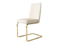 Juego de 2 sillas de comedor en terciopelo beige con respaldo tapizado y patas doradas.