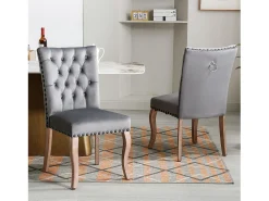 Juego de 2 sillas de terciopelo gris con patas de madera curvadas, remaches negros
