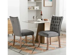 Juego de 2 sillas de terciopelo gris con patas de madera curvadas, remaches negros