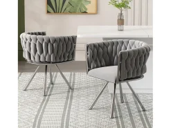 Juego de 4 sillas giratorias con reposabrazos, patas de metal plateado y tapizadas en terciopelo gris.