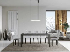 Mesa de comedor extensible Karry evolución-Color Gris cemento-Soporte 4 pies-Ancho extensible