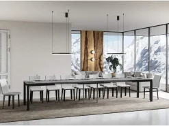 Mesa de comedor extensible Karry evolución-Color Gris cemento-Soporte 2 pies-Ancho extensible