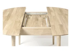 Mesa de comedor redonda extensible de 120 a 155 cm en roble macizo blanqueado Kundy