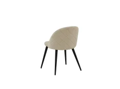Silla de comedor de terciopelo beige.