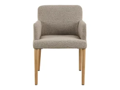 Silla de comedor Zoe con reposabrazos bouclé beige.