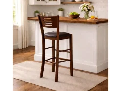 Taburete Verona en madera de nogal oscuro, altura 73 cm, con asiento acolchado marrón.